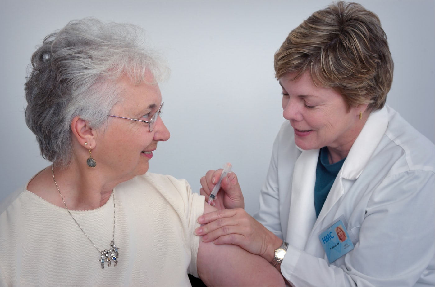 A PowerCare nurse with a resident during a routine check